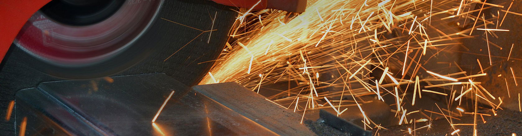 Cutting metal with grinder. Sparks while grinding steel