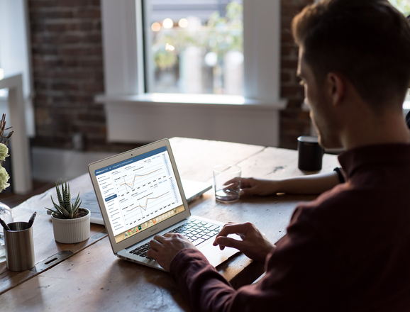 man with notebook in office