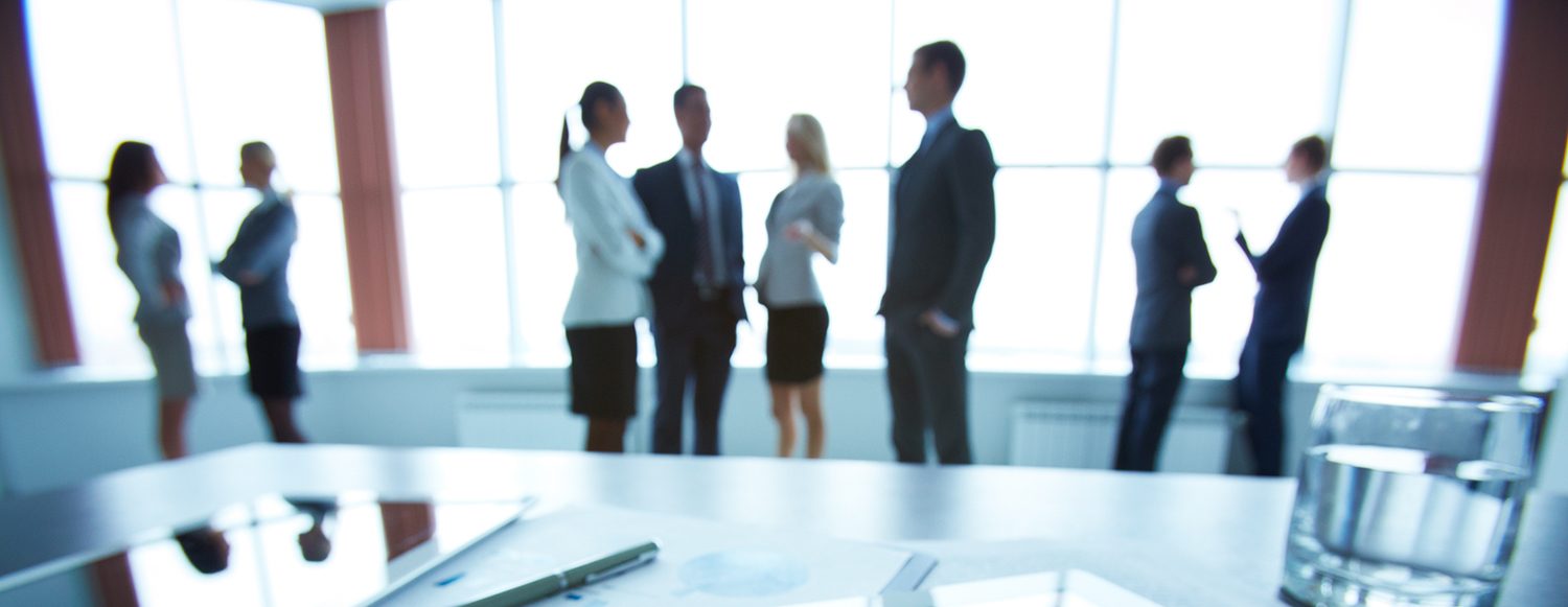 silhuettes of people at a business meeting